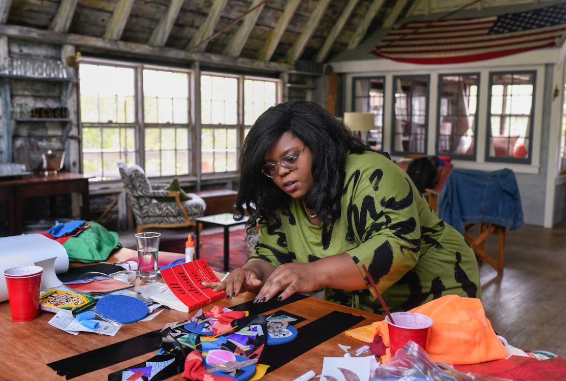 Artist Chanel Thervil works on her art inside the Hawthorne Barn at Twenty Summers in Provincetown. 