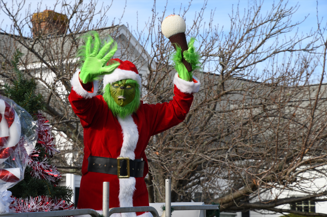 The Grinch aboard a float in the 2021 Falmouth Christmas Parade.